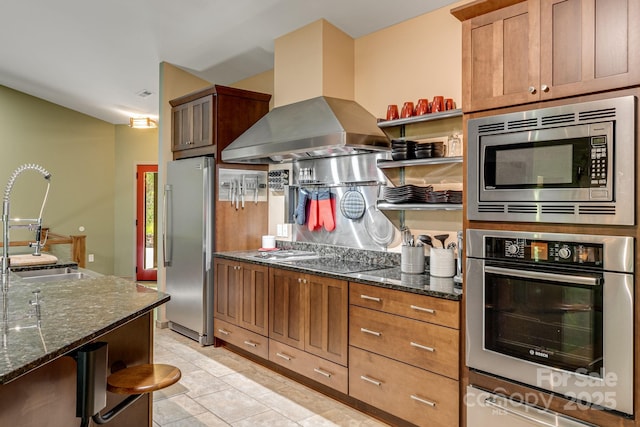 1760 Winding Creek Dr, Waynesville, NC 28786 - kitchen featuring stainless steel appliances, a sink, open shelves, island range hood, and dark stone counters