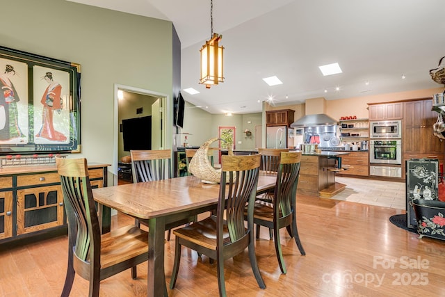 1760 Winding Creek Dr, Waynesville, NC 28786 - dining room with a skylight and light wood finished floors