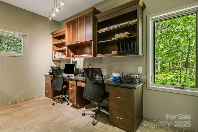 1760 Winding Creek Dr, Waynesville, NC 28786 - home office featuring plenty of natural light, built in study area, and baseboards