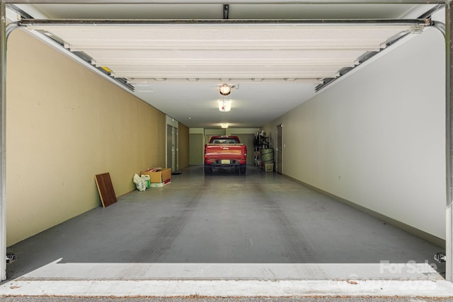 1760 Winding Creek Dr, Waynesville, NC 28786 - garage featuring a garage door opener