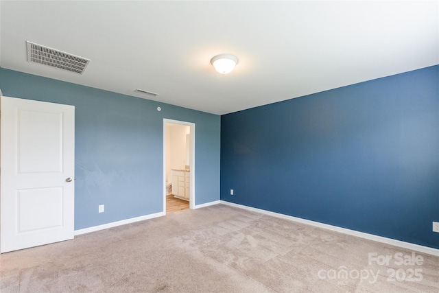 3073 Langhorne Ave SW, Concord, NC 28027 - unfurnished bedroom with carpet floors, baseboards, and ensuite bathroom
