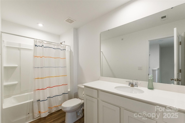 3073 Langhorne Ave SW, Concord, NC 28027 - bathroom with toilet, wood finished floors, vanity, and shower / bath combination with curtain
