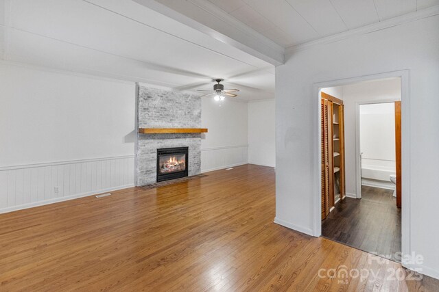 956 Stony Point Rd, Kings Mountain, NC 28086 - unfurnished living room featuring crown molding, wood finished floors, ceiling fan, and a large fireplace