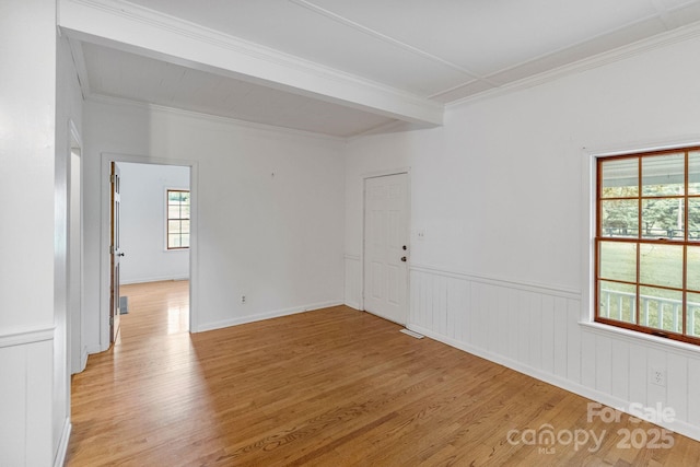 956 Stony Point Rd, Kings Mountain, NC 28086 - unfurnished room with light wood-style floors, ornamental molding, wainscoting, and beam ceiling
