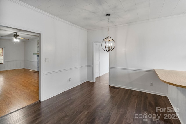 956 Stony Point Rd, Kings Mountain, NC 28086 - unfurnished dining area featuring wood finished floors, a chandelier, ornamental molding, a ceiling fan, and baseboards