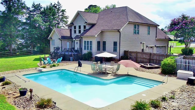 141 Weathers Creek Rd, Troutman, NC 28166 - back of house with a patio area, a fenced backyard, and roof with shingles