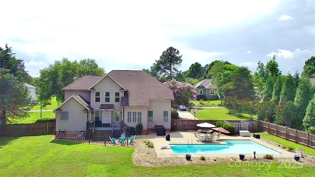141 Weathers Creek Rd, Troutman, NC 28166 - back of property featuring a patio area and a fenced backyard