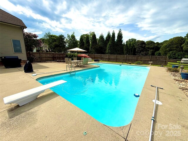 141 Weathers Creek Rd, Troutman, NC 28166 - view of swimming pool with a diving board, a patio, and a fenced backyard