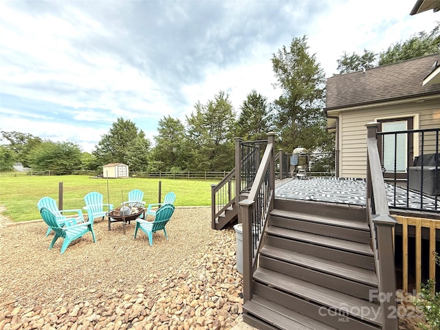 141 Weathers Creek Rd, Troutman, NC 28166 - view of yard with stairs, a fire pit, a wooden deck, a shed, and view of wooded area