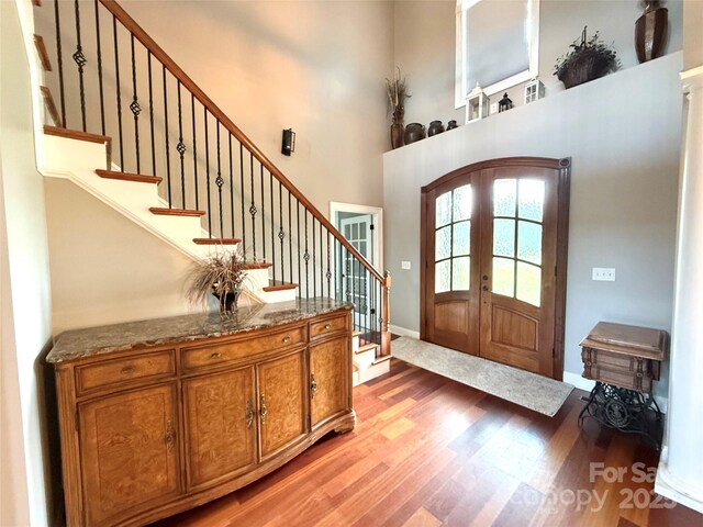 141 Weathers Creek Rd, Troutman, NC 28166 - entrance foyer featuring light wood-style floors, french doors, stairs, and a high ceiling