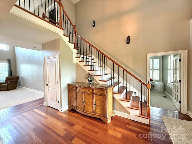 141 Weathers Creek Rd, Troutman, NC 28166 - stairway with a high ceiling and wood finished floors