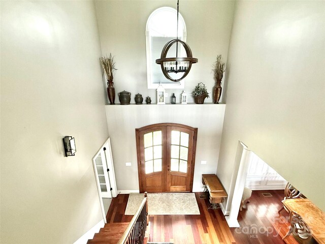141 Weathers Creek Rd, Troutman, NC 28166 - foyer with french doors, wood finished floors, and a high ceiling