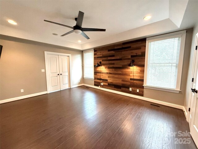 141 Weathers Creek Rd, Troutman, NC 28166 - unfurnished living room featuring ceiling fan, dark wood finished floors, healthy amount of natural light, and recessed lighting