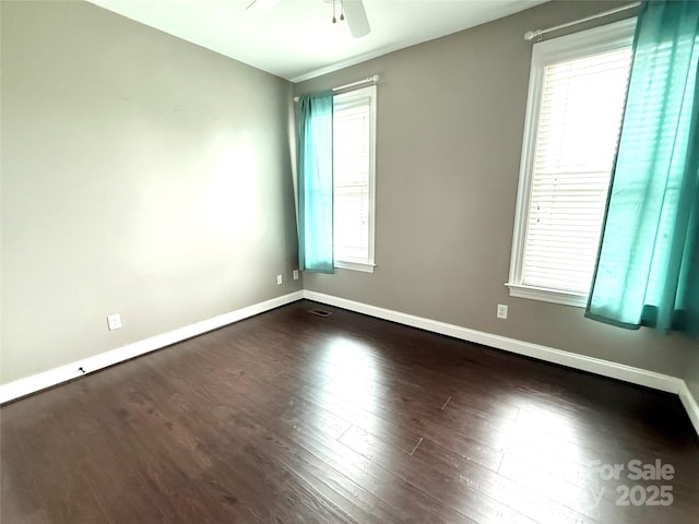 141 Weathers Creek Rd, Troutman, NC 28166 - unfurnished room featuring healthy amount of natural light, ceiling fan, and dark wood-style flooring