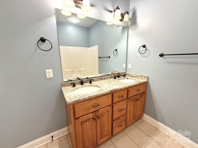 141 Weathers Creek Rd, Troutman, NC 28166 - bathroom with double vanity and tile patterned flooring