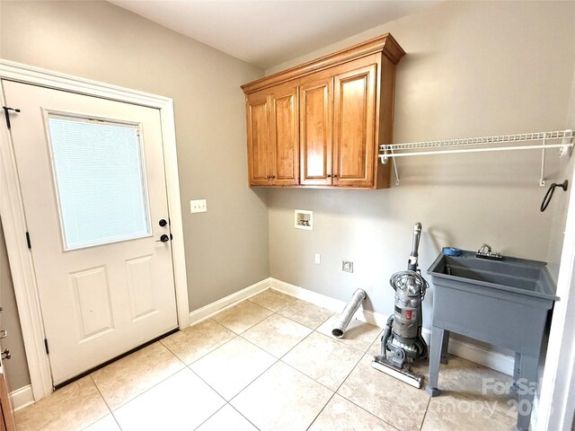 141 Weathers Creek Rd, Troutman, NC 28166 - laundry room with washer hookup, cabinet space, and light tile patterned flooring