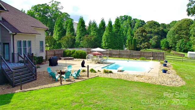 141 Weathers Creek Rd, Troutman, NC 28166 - view of pool featuring a patio area, a fenced backyard, and a fire pit