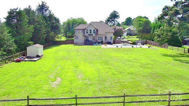 141 Weathers Creek Rd, Troutman, NC 28166 - fenced backyard with a storage unit