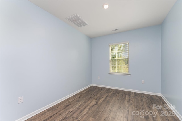 347 Carolina Hemlock Dr, Locust, NC 28097 - spare room featuring baseboards, dark wood-type flooring, and recessed lighting