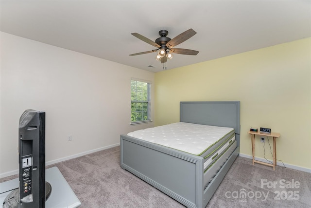 347 Carolina Hemlock Dr, Locust, NC 28097 - bedroom with light colored carpet, baseboards, and a ceiling fan