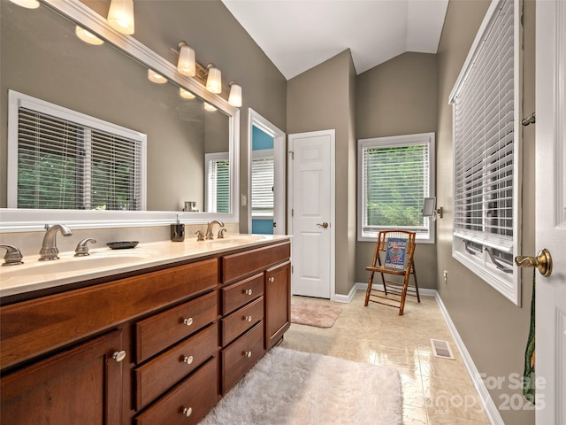 117 Eagles Crest Way, Lake Lure, NC 28746 - bathroom with double vanity, lofted ceiling, baseboards, and tile patterned flooring