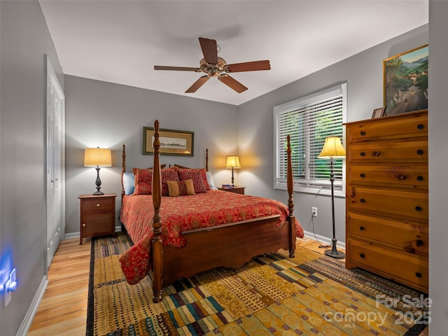117 Eagles Crest Way, Lake Lure, NC 28746 - bedroom with baseboards, wood finished floors, and ceiling fan
