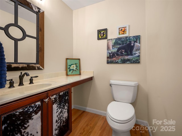 117 Eagles Crest Way, Lake Lure, NC 28746 - half bath featuring toilet, wood finished floors, vanity, and baseboards