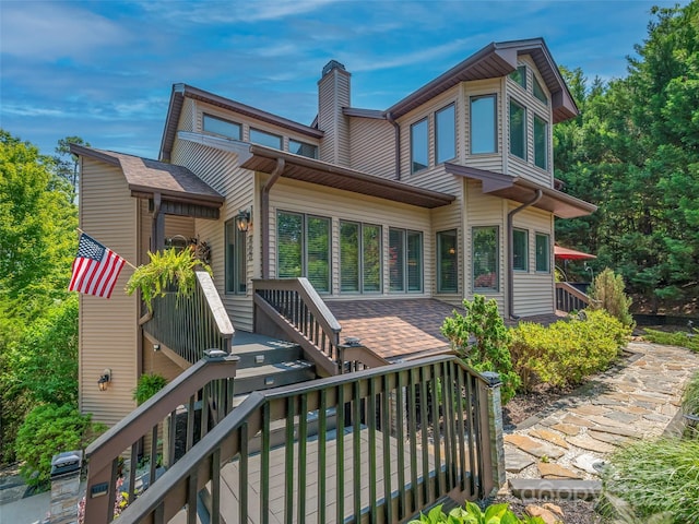 117 Eagles Crest Way, Lake Lure, NC 28746 - back of property featuring a chimney and a wooden deck
