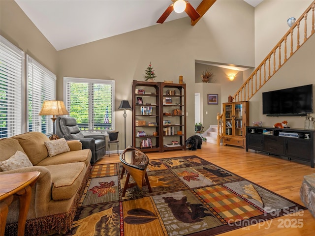 117 Eagles Crest Way, Lake Lure, NC 28746 - living area featuring high vaulted ceiling, stairway, wood finished floors, and ceiling fan