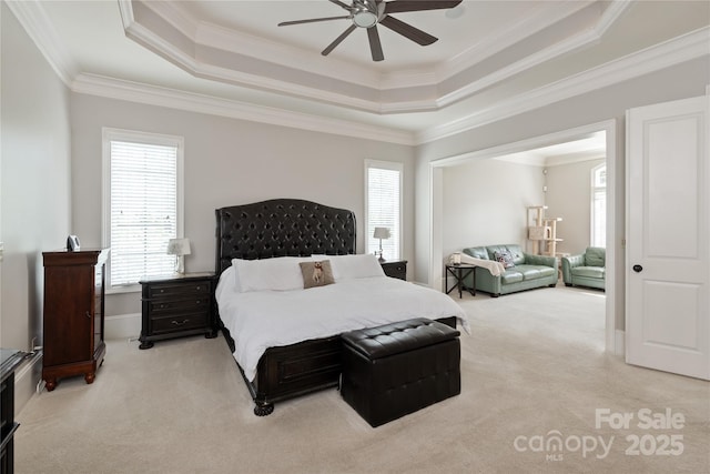 1032 Seminole Dr, Waxhaw, NC 28173 - bedroom featuring a tray ceiling, light carpet, ornamental molding, and ceiling fan