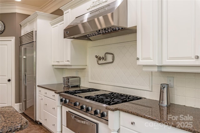 1032 Seminole Dr, Waxhaw, NC 28173 - kitchen featuring extractor fan, appliances with stainless steel finishes, white cabinetry, backsplash, and crown molding