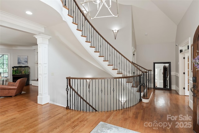 1032 Seminole Dr, Waxhaw, NC 28173 - entrance foyer with wood finished floors, baseboards, high vaulted ceiling, stairs, and recessed lighting