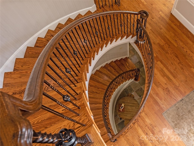 1032 Seminole Dr, Waxhaw, NC 28173 - stairway featuring wood finished floors