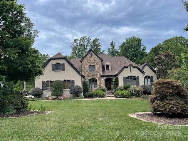 1032 Seminole Dr, Waxhaw, NC 28173 - french country inspired facade with stone siding and a front lawn