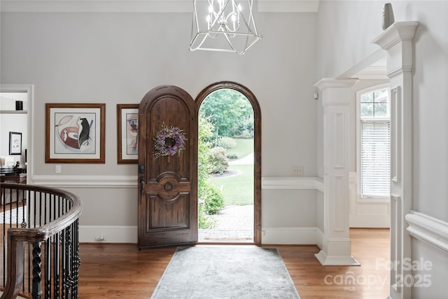 1032 Seminole Dr, Waxhaw, NC 28173 - foyer entrance with plenty of natural light, wood finished floors, a chandelier, and a towering ceiling