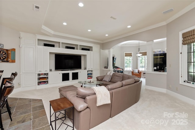 1032 Seminole Dr, Waxhaw, NC 28173 - living area featuring arched walkways, ornamental molding, recessed lighting, ornate columns, and dark carpet