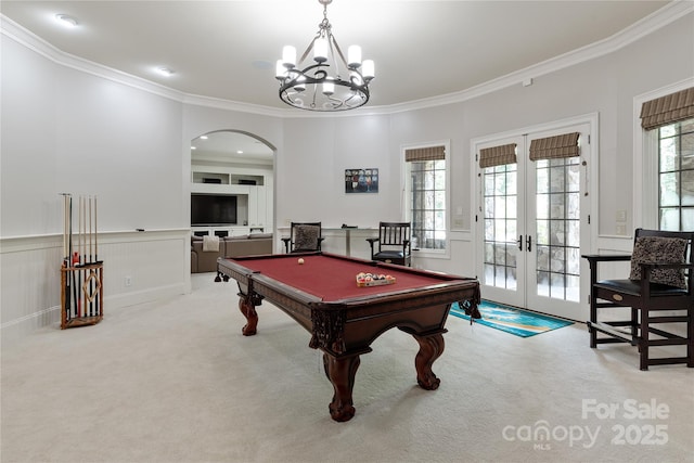 1032 Seminole Dr, Waxhaw, NC 28173 - recreation room with french doors, arched walkways, crown molding, carpet flooring, and a chandelier
