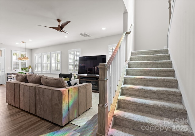 5481 Comiskey Aly, Kannapolis, NC 28081 - living area with stairway, plenty of natural light, wood finished floors, ceiling fan, and recessed lighting