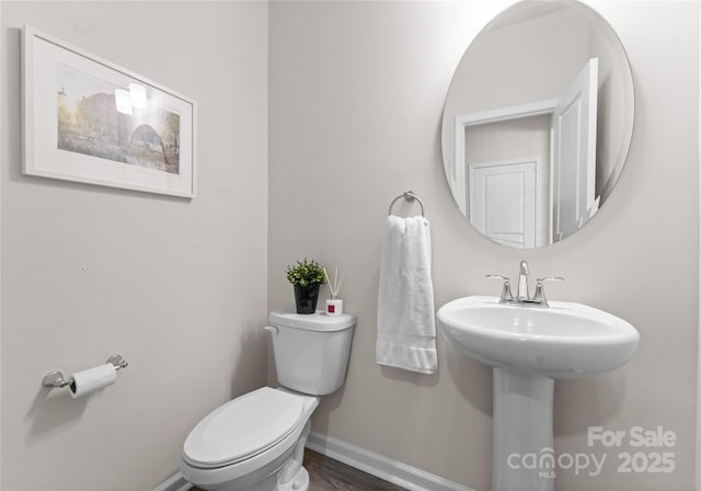 5481 Comiskey Aly, Kannapolis, NC 28081 - half bathroom with baseboards, toilet, and wood finished floors