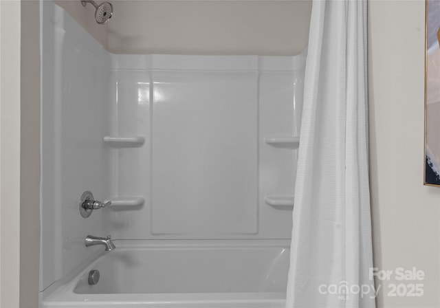 5481 Comiskey Aly, Kannapolis, NC 28081 - bathroom featuring shower / bath combo with shower curtain