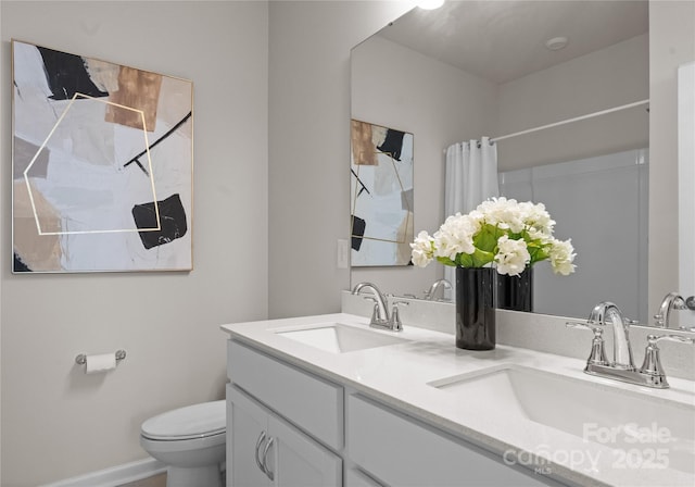 5481 Comiskey Aly, Kannapolis, NC 28081 - bathroom with double vanity, toilet, curtained shower, and baseboards