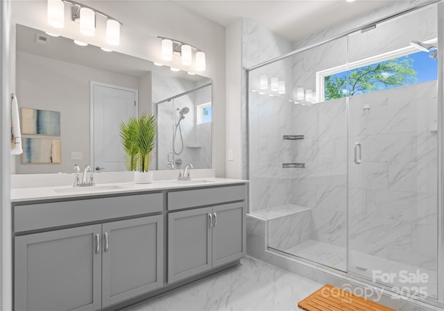 5481 Comiskey Aly, Kannapolis, NC 28081 - bathroom featuring marble look tile flooring, a marble finish shower, and double vanity