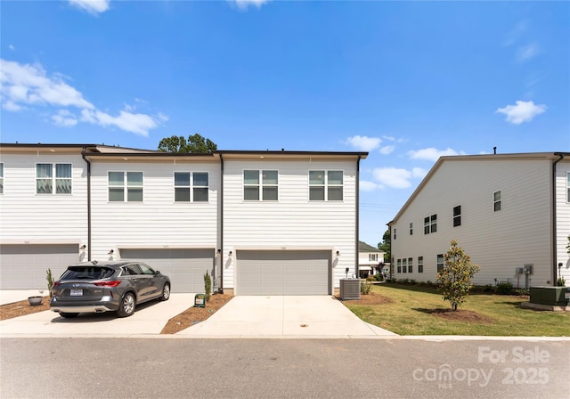 5481 Comiskey Aly, Kannapolis, NC 28081 - view of front of house with central AC unit, concrete driveway, and an attached garage