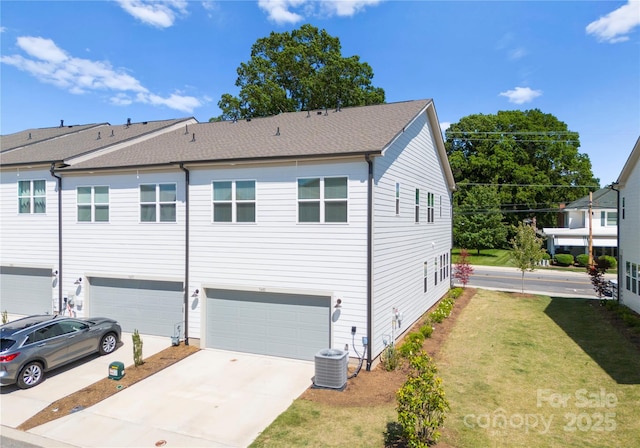 5481 Comiskey Aly, Kannapolis, NC 28081 - view of property with an attached garage, driveway, a front yard, central AC, and a shingled roof