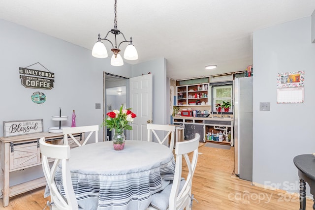 2210 Joes Lake Rd, Shelby, NC 28152 - dining area featuring a chandelier and light wood-style flooring