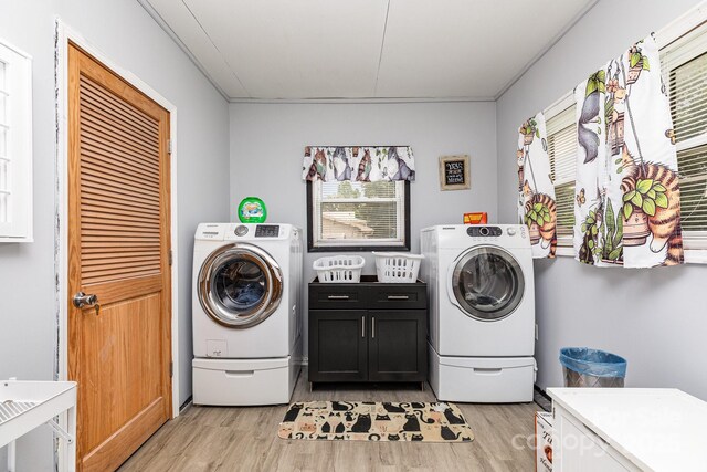 2210 Joes Lake Rd, Shelby, NC 28152 - laundry area featuring cabinet space, light wood-type flooring, and healthy amount of natural light