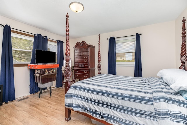 2210 Joes Lake Rd, Shelby, NC 28152 - bedroom featuring multiple windows and light wood-style floors