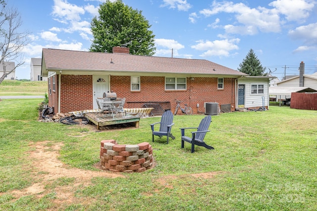 2210 Joes Lake Rd, Shelby, NC 28152 - rear view of property featuring brick siding, central AC unit, a chimney, and a lawn