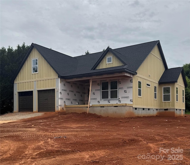 2589 Polo Ln, Maiden, NC 28650 - view of front of home featuring roof with shingles, covered porch, board and batten siding, an attached garage, and driveway