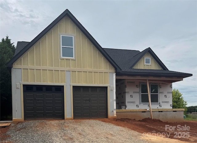 2589 Polo Ln, Maiden, NC 28650 - view of front of property with board and batten siding, a porch, gravel driveway, and a shingled roof